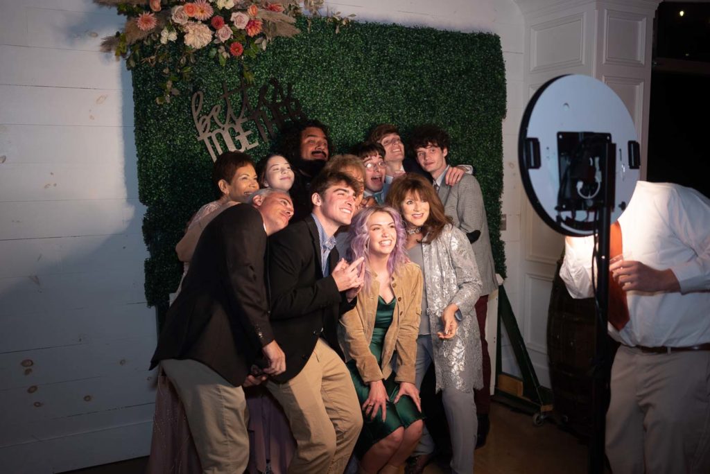 Wedding guests using the photo booth