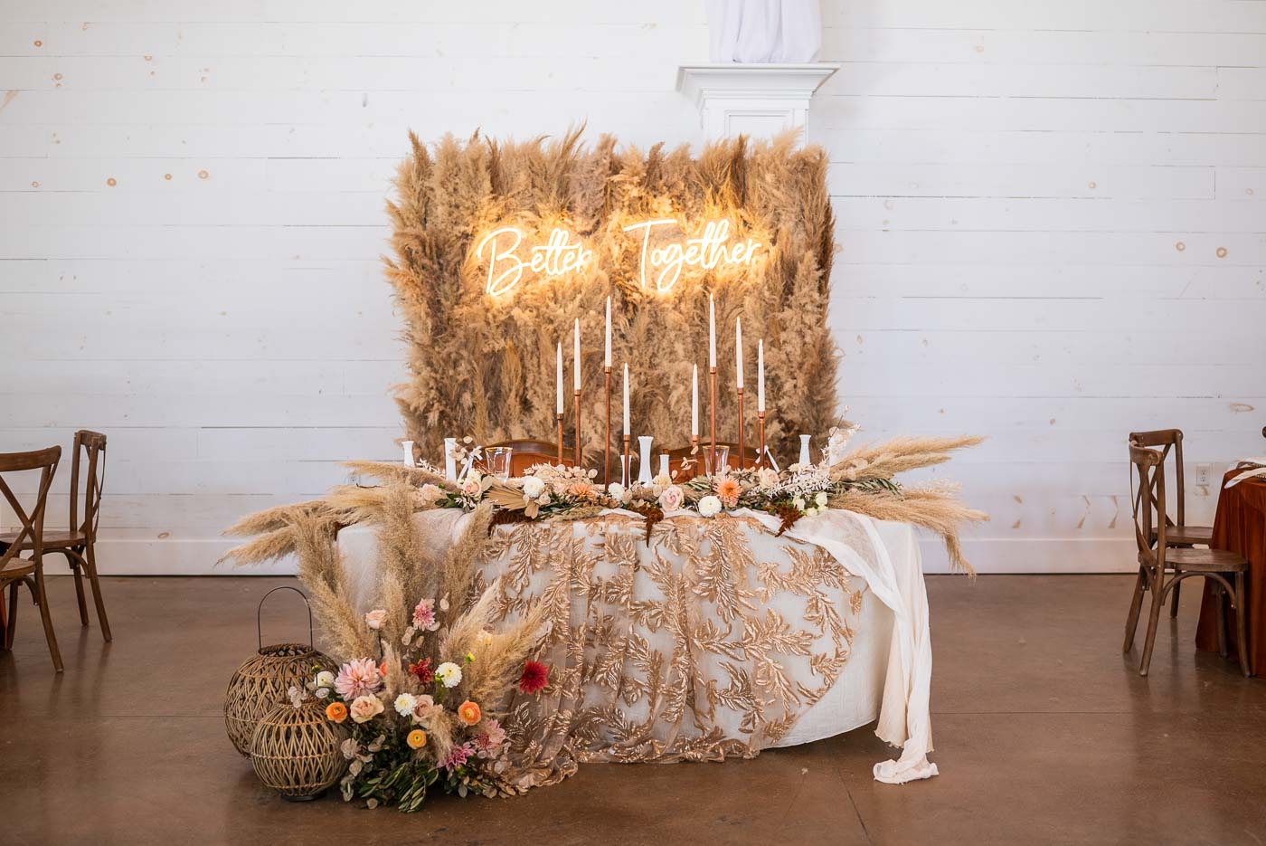 Sweatheart table with pampas grass backdrop and Better Together sign