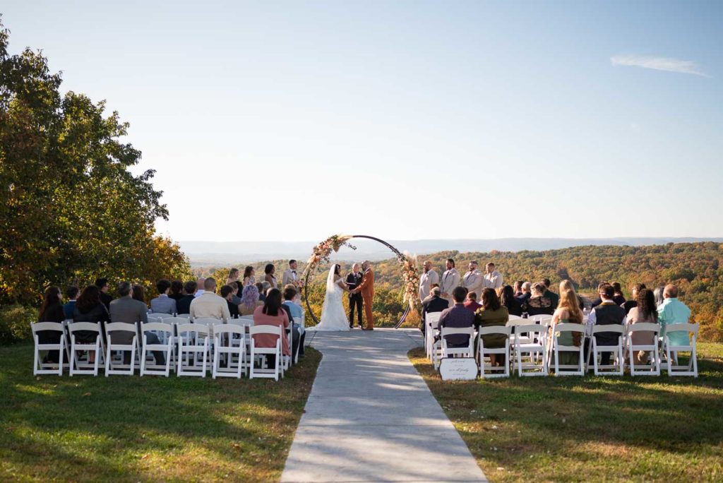 Wide angle of the ceremony in front of mountains