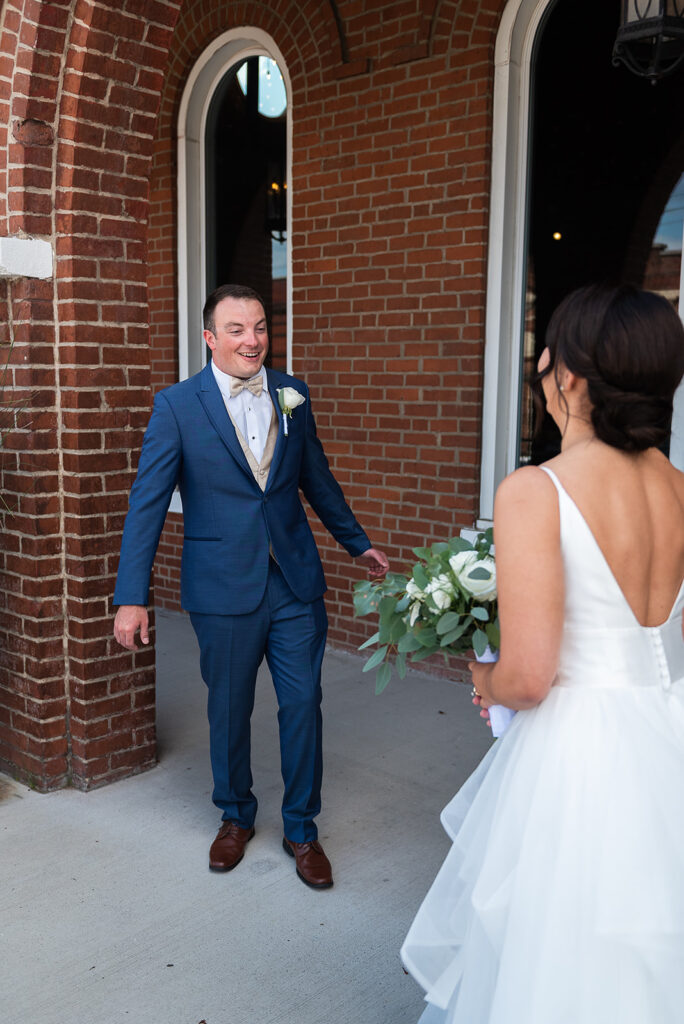 Groom turns around to see bride for first look